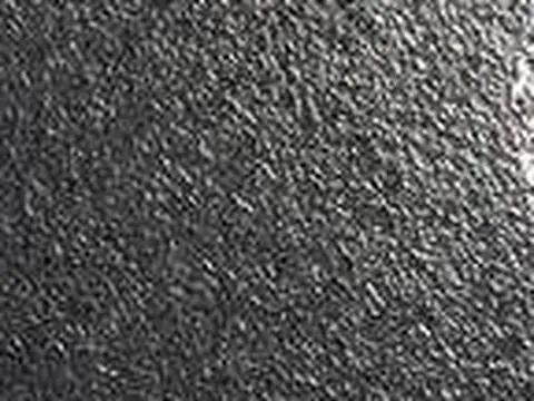 Close-up of black granite with a lappatro (textured) finish