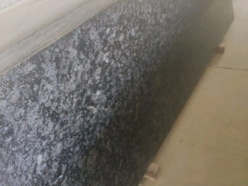 Ocean Blue granite slab: dark base with blue-white swirls